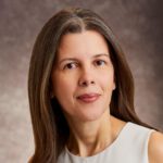 Headshot of Maria Negrete-Gruson